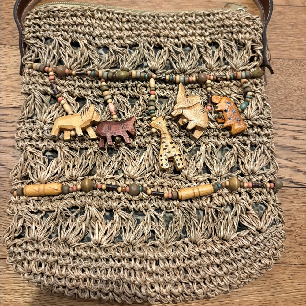 Cappelli Straworld Inc straw crossbody purse with beaded dangle jungle animals